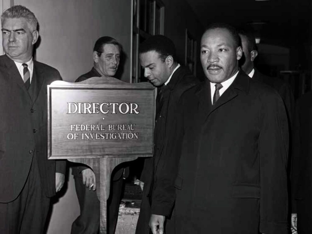 Martin Luther King arrives at the FBI to speak with J. Edgar Hoover on December 1, 1964. Their meeting was highly
publicised, but evasive and dishonest on Hoover’s part